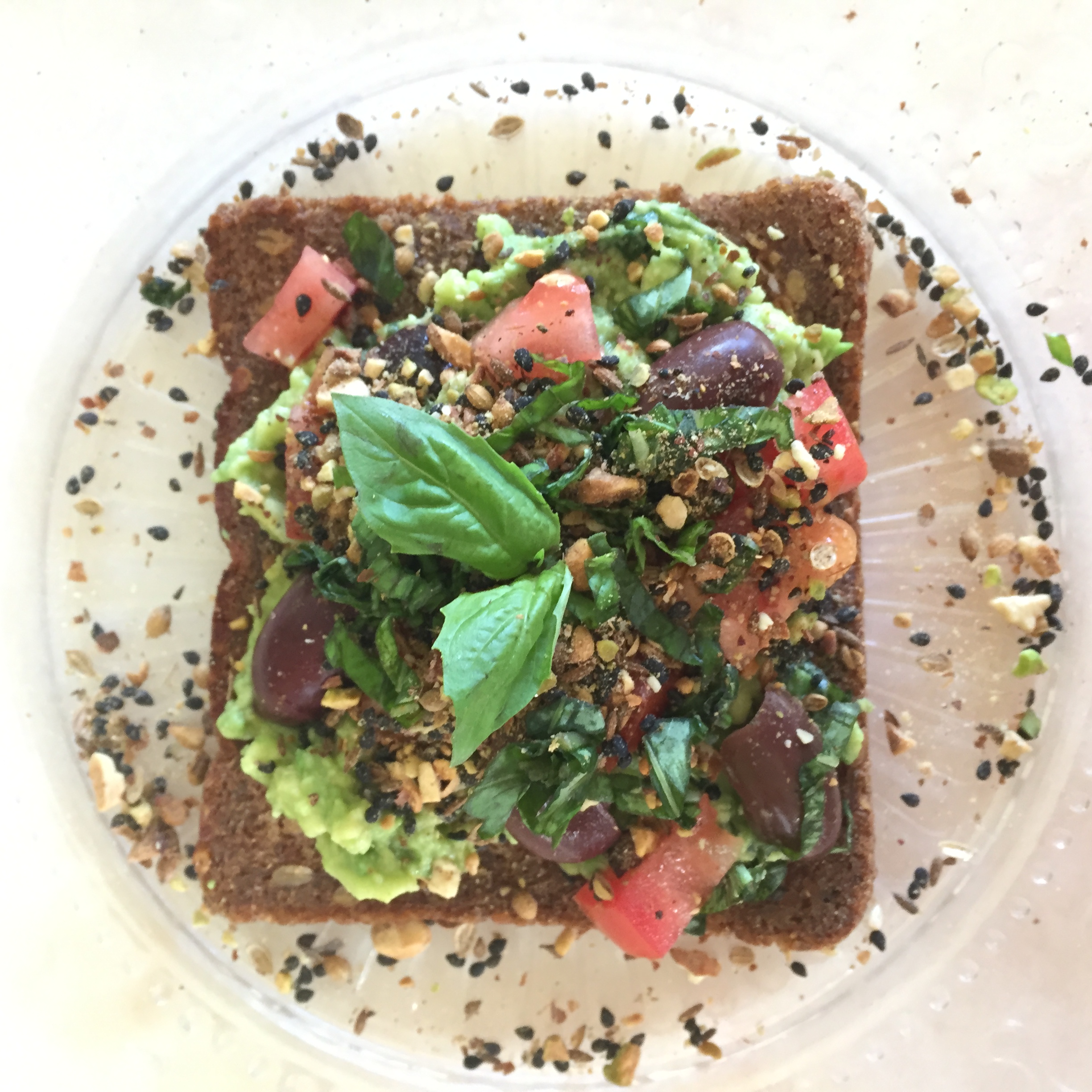 Avocado Toast with Olives, Tomatoes, Fresh Basil and Dukkah